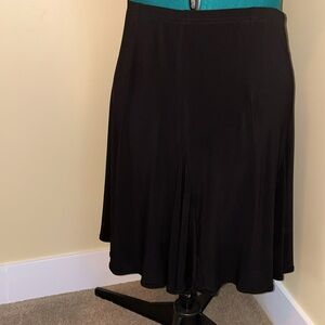 Flouncy skirt in stretch fabric is in excellent condition.
